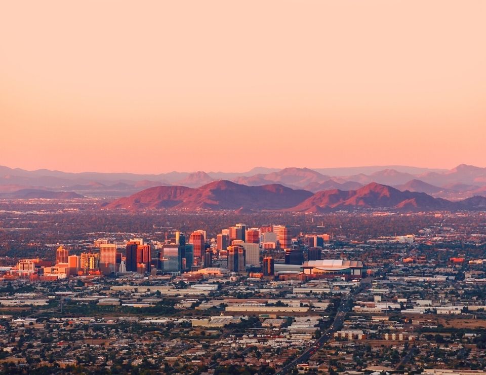sunset view of downtown Phoenix, Living in Phoenix AZ vs Chicago IL.